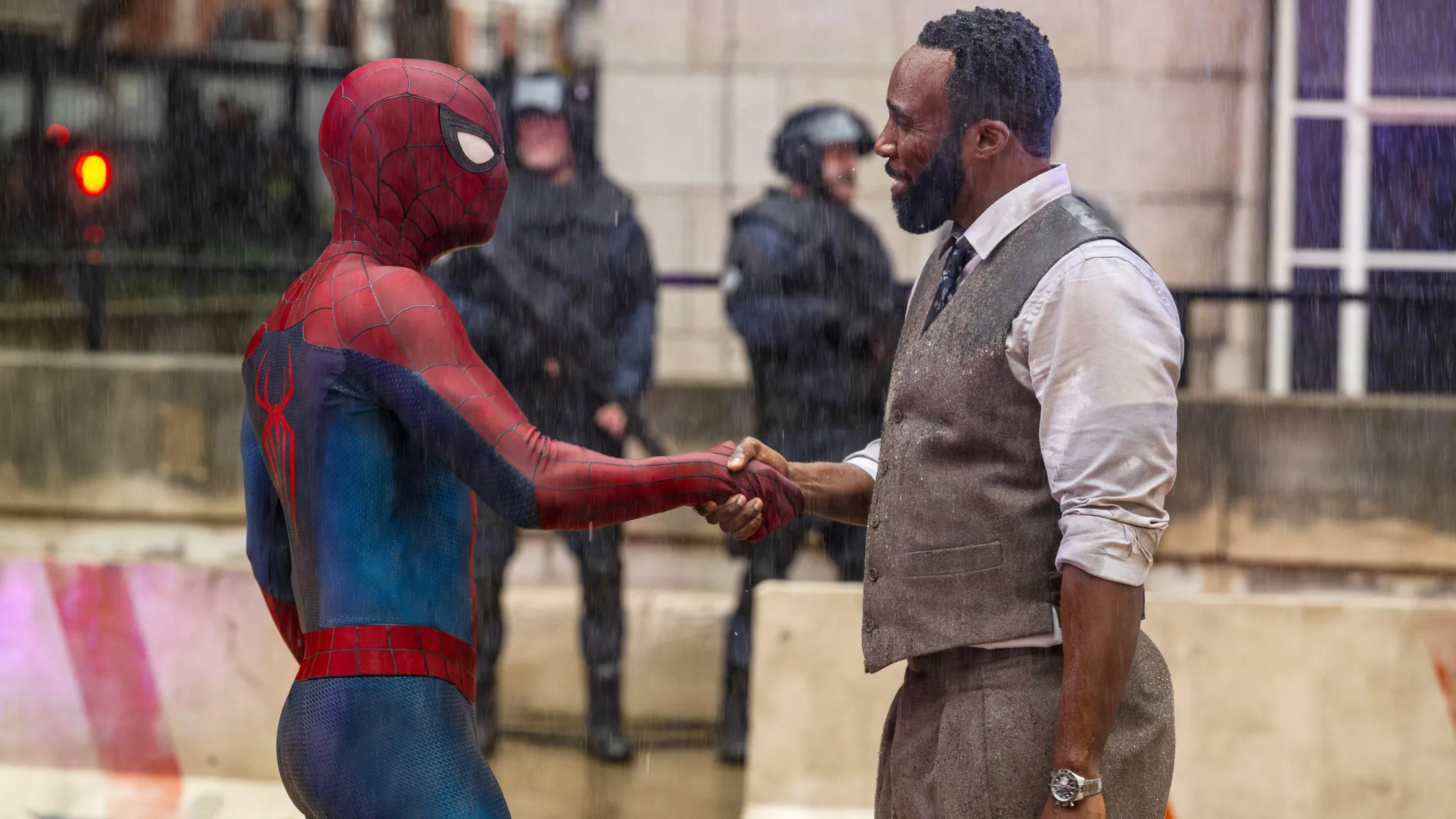 Spider-Man )Tom Holland) shaking Bill Metzger's (Tramell Tillman) hand in Spider-Man: Brand New Day.
